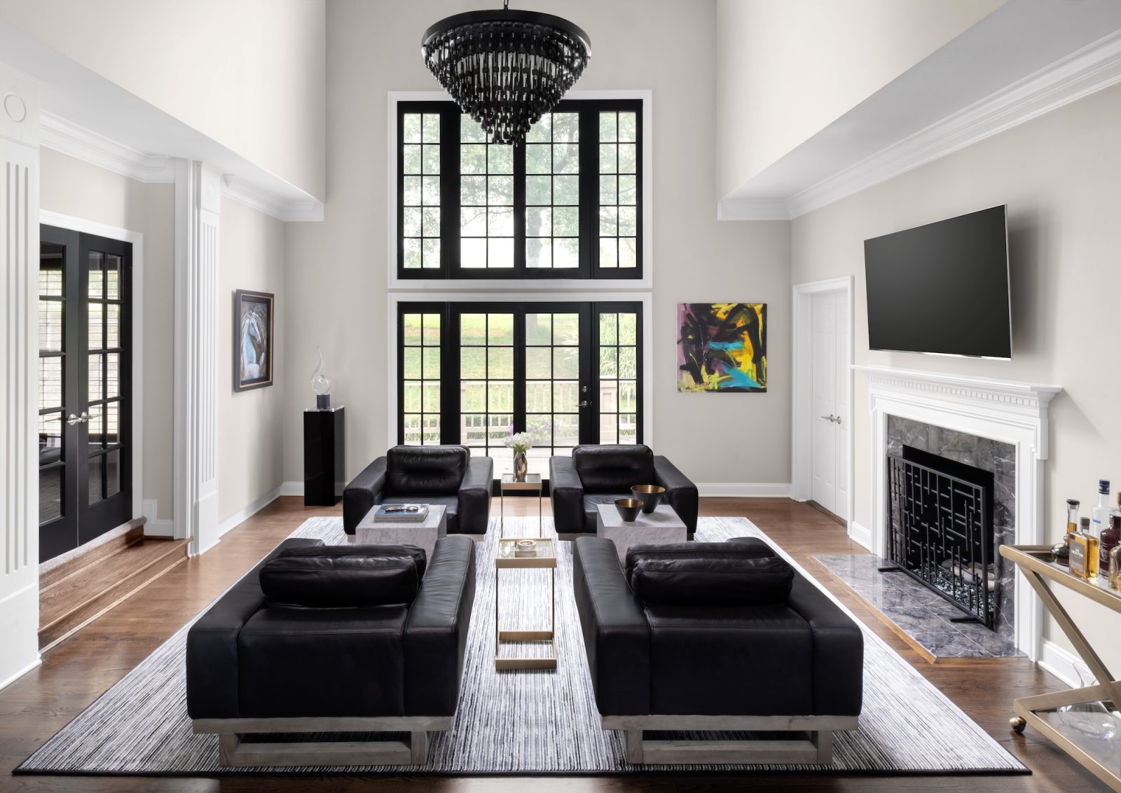 contemporary living room with black leather seating