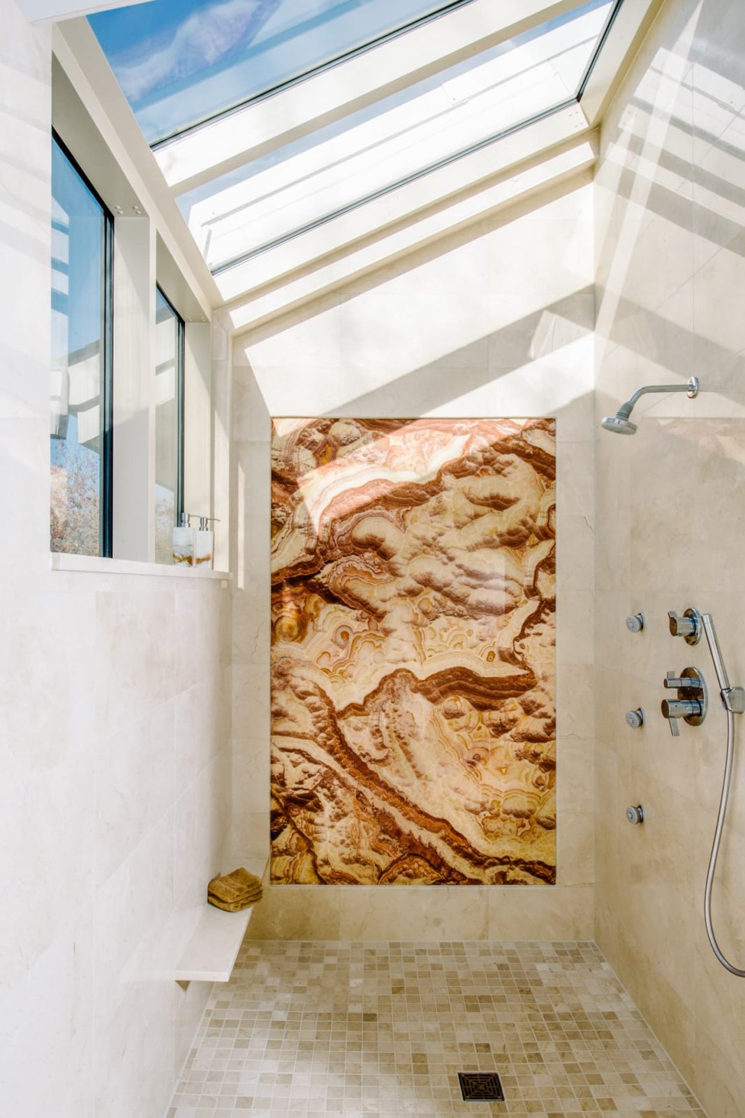 contemporary bathroom shower onyx wall with skylights and cathedral ceiling