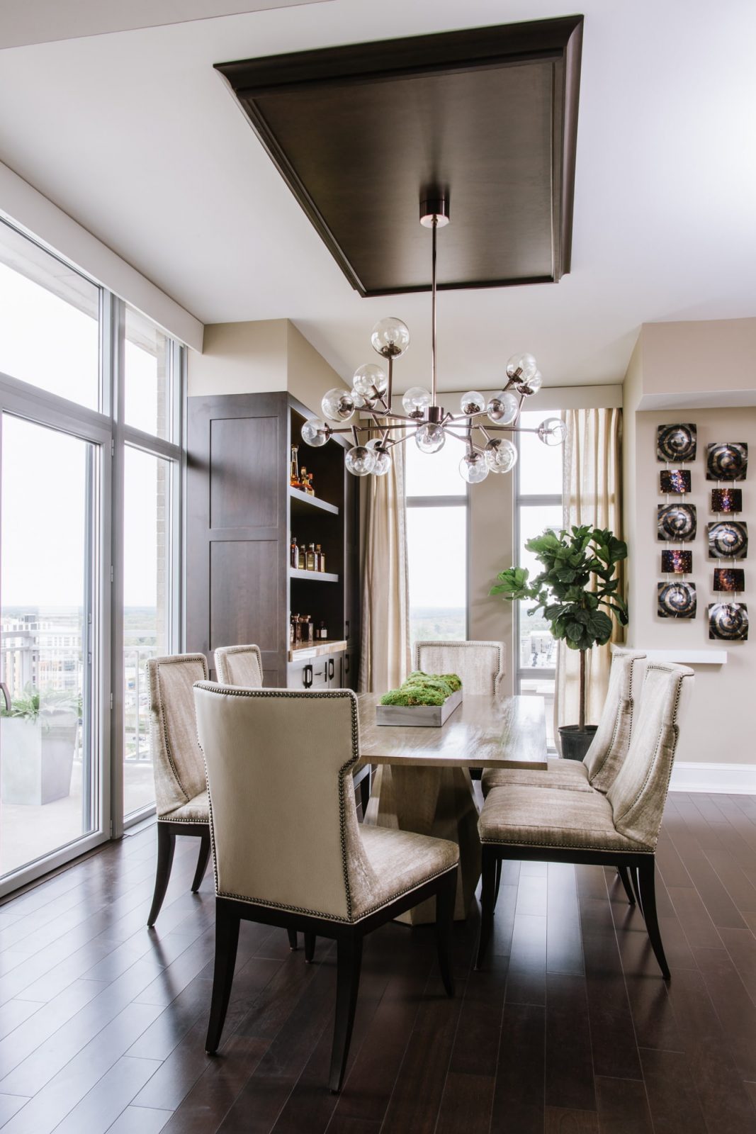 contemporary condo chandelier neutral colors dark floor built in bar